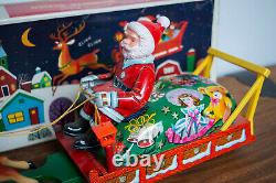 1950's BATTERY OPERATED SANTA CLAUS ON REINDEER SLEIGH TIN LITHO TOY
