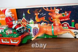 1950's BATTERY OPERATED SANTA CLAUS ON REINDEER SLEIGH TIN LITHO TOY