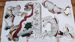 4 Pc Porcelain Christmas Ensemble Santa, Sleigh, Two Reindeers Read