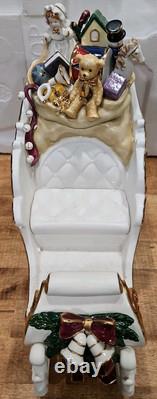 4 Pc Porcelain Christmas Ensemble Santa, Sleigh, Two Reindeers Read