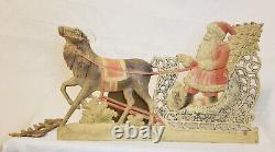 Antique German pressed cardboard Christmas decoration Santa, Reindeer, and Sled