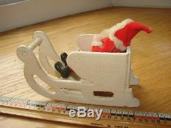 Antique Santa Claus in sleigh with two reindeer