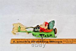Antique santa/sleigh/reindeer toy wind-up red green tin celluloid Japan works