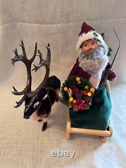 Byers Choice Santa Claus holding Wreath & Whip in Ceramic Sleigh with Reindeer