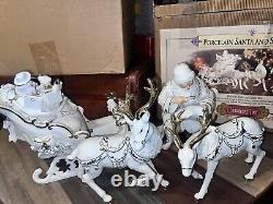 Grandeur Porcelain Santa and Sleigh Set with Reindeer 2001 Collectors Edition EUC