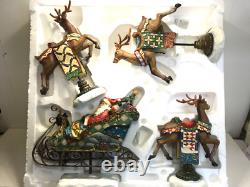 Kirkland Signature Santa Sleigh and Reindeer Christmas 9.5 Figurines- Set of 4