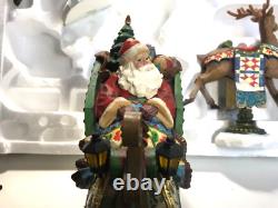 Kirkland Signature Santa Sleigh and Reindeer Christmas 9.5 Figurines- Set of 4