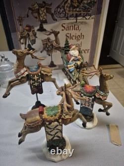 Kirkland Signature Santa Sleigh and Reindeer Christmas 9.5 Figurines- Set of 4