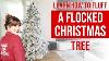 Learn To Fluff Flocked Christmas Tree Elevate Your Decorating
