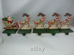 MIDWEST CAST IRON SANTA IN SLEIGH AND 4 SANTA'S REINDEER STOCKING HANGER SET 5pc