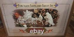NIB Grandeur Noel Porcelain Santa and Sleigh Set withReindeer Collector's Edition