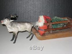 OLD REINDEER SLEIGH WITH XMAS TREE DRIVEN BY SANTA, ALL GERMAN