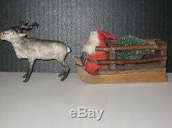 OLD REINDEER SLEIGH WITH XMAS TREE DRIVEN BY SANTA, ALL GERMAN