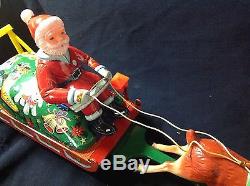 Santa Claus On Reindeer Sleigh Battery Operated Mystery Action Tin Toy Vintage