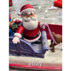 Santa Claus on Sled with Rudolph the red nose Reindeer Musical Lighted Figurine