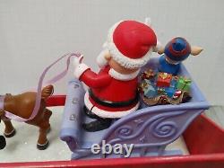Santa Claus on Sled with Rudolph the red nose Reindeer Musical Lighted Figurine