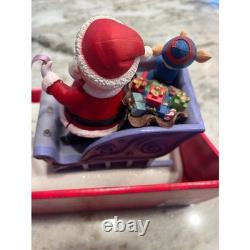Santa Claus on Sled with Rudolph the red nose Reindeer Musical Lighted Figurine
