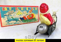 Santa Claus on sled with reindeer old celluloid wind-up toy Japan. SEE MOVIE
