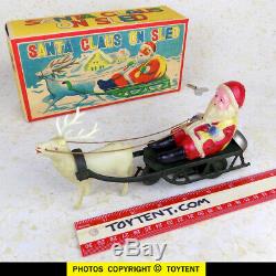 Santa Claus on sled with reindeer old celluloid wind-up toy Japan. SEE MOVIE