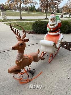 Santa In Sleigh WithToys & 1 Reindeer With Sleigh Bells Lighted Blow Mold vintage