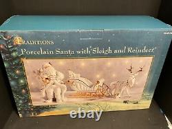 Traditions White Porcelain Santa With Sleigh and Reindeer With Gold Accents