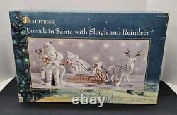 Traditions White Porcelain Santa With Sleigh and Reindeer With Gold Accents