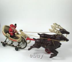 VTG Cast Iron Mechanical Enameled Fireplace Santa in Sleigh Reindeer Pull Toy