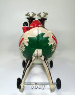 VTG Cast Iron Mechanical Enameled Fireplace Santa in Sleigh Reindeer Pull Toy