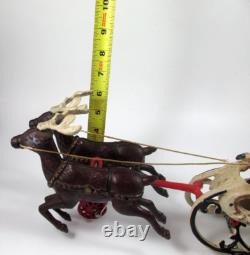 VTG Cast Iron Mechanical Enameled Fireplace Santa in Sleigh Reindeer Pull Toy