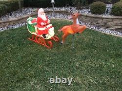 Vintage Blow Mold Santa and sleigh and reindeer in great shape for its age