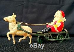 Vintage Tin Windup Celluloid Santa Claus With Sleigh Reindeer Bell Toy Christmas