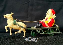 Vintage Tin Windup Celluloid Santa Claus With Sleigh Reindeer Bell Toy Christmas