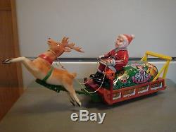 Vintage Xmas Metal Battery Operated Toy Santa Soft Head Sleigh Reindeer