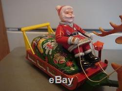 Vintage Xmas Metal Battery Operated Toy Santa Soft Head Sleigh Reindeer