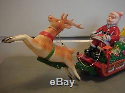 Vintage Xmas Metal Battery Operated Toy Santa Soft Head Sleigh Reindeer