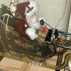 Vintage animated Santa on sleigh w reindeer