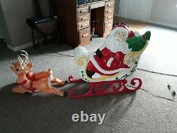 Vintage lawn santa and sleigh and two reindeer blow mold