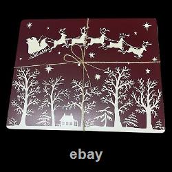 Williams Sonoma Santa Sleigh Reindeer Hard Cork Placemats Lot of 4 Maroon White