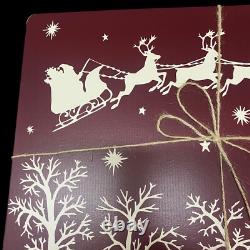 Williams Sonoma Santa Sleigh Reindeer Hard Cork Placemats Lot of 4 Maroon White
