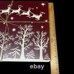 Williams Sonoma Santa Sleigh Reindeer Hard Cork Placemats Lot of 4 Maroon White